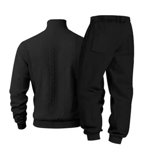 Detailed back view showing the texture of a black jacquard knit men's high collar tracksuit.