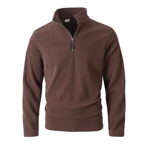 Detail view of a men's solid brown quarter-zip fleece pullover with a stand collar