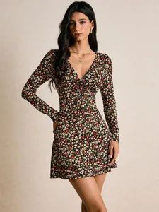 Front view of a vintage floral print mini dress with V-neck and lace-up details