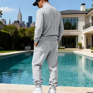 Rear view of men's grey heavyweight cable-knit tracksuit with high-neck sweater.
