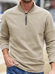 Men's casual solid color fleece sweatshirt with stand collar and half-zipper closure.