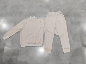 Detailed back view of men's heavy beige jacquard knit sweatshirt and joggers set