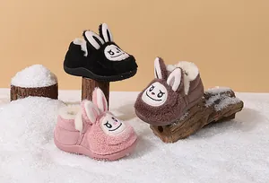Detail view of cute cartoon bunny toddler snow boots with plush fleece lining