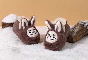 Adorable plush toddler winter boots featuring cute cartoon rabbit design in snow scene
