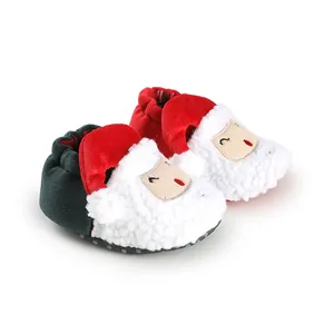 Close-up of Santa Claus plush baby booties for Christmas winter wear