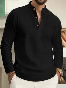 Detail view of men's black waffle knit long-sleeve Henley shirt with pocket