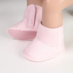 Soft pink infant winter boots featuring magic tape closure and non-slip soles for newborns