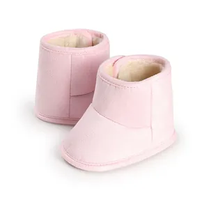 Warm pink fleece-lined baby winter boots with soft non-slip soles for pre-walkers.