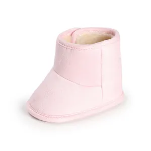 Side view of pink soft-sole baby boot with warm fleece lining and velcro closure.