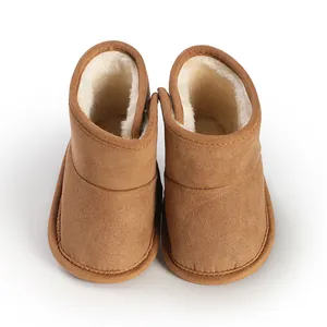 Detailed view of brown baby winter snow boots with soft white lamb fleece lining