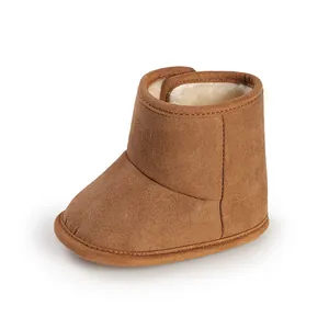 Close-up detail of chestnut baby winter boot with soft faux fur lining and velcro strap