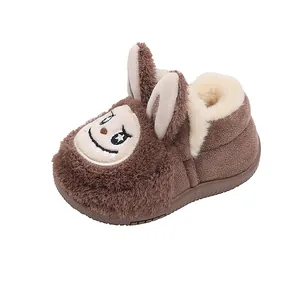 Cute brown cartoon children's winter boots with thick warm plush lining and ears.