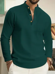 Detail view of a men's dark green long-sleeved Henley shirt featuring a chest pocket