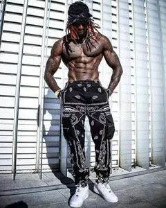 Stylish men's street style cargo joggers featuring black and white paisley prints.