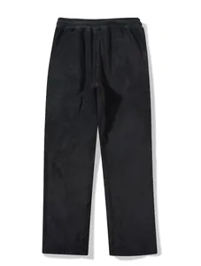 Full flat lay view of black fleece joggers featuring an elastic waist and soft texture.