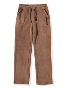 Close-up detail of soft brown plush men's lounge pants featuring a drawstring waist