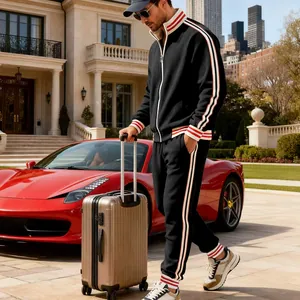 Men's heavy fleece athletic tracksuit set shown in a luxury lifestyle travel scene.