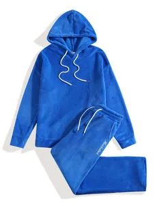Detailed view of a blue men's fleece hoodie and matching jogger set with script detail
