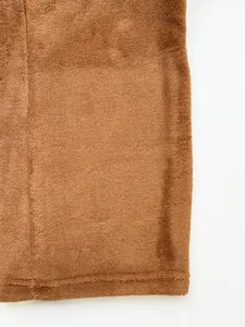 Close-up detail of the soft brown plush fabric on these men's casual sports trousers.
