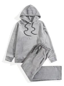 Two-piece grey men's oversized fleece hoodie and matching jogger pants set for winter