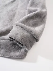 Close-up of gray plush hoodie cuff showing soft flannel fabric texture
