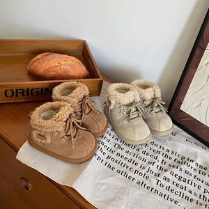Detail of warm fleece-lined winter snow boots for toddlers in brown and beige colors