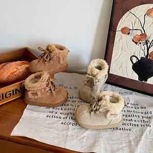 Cozy beige and tan children's snow boots with warm faux fur lining for winter walking