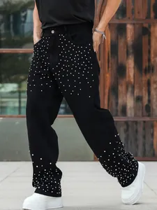 Premium men's loose straight black denim jeans featuring sparkling rhinestone studs