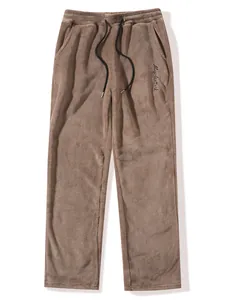 Detailed texture of men's brown coral fleece leisure sweatpants with embroidery