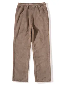 Detail of men's brown coral fleece trousers showing plush texture and elastic waistband