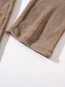 Detailed macro view of soft coral fleece fabric texture on men's winter hoodie