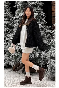 Warm brown winter snow boots for women with cozy faux fur lining in snowy outdoor scene