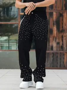 Detailed view of rhinestone studded black wide leg denim jeans for men with silver chain