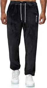 Detail of black fleece sweatpants for men featuring white drawstring and embroidery