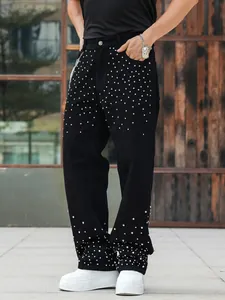 Men's loose black straight jeans with sparkling rhinestone embellishments.
