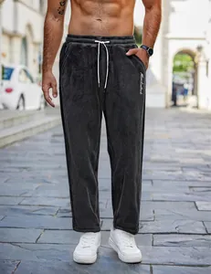 Close-up of men's grey fuzzy lounge pants with white drawstring and pocket detail
