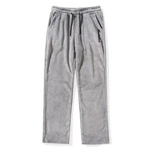 Grey plush men's casual pants with black drawstring and MuscleAttack embroidery detail