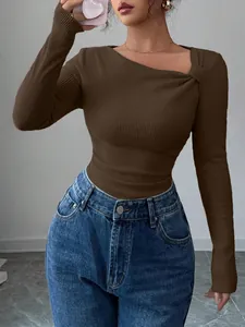 Detail view of brown ribbed knit top with asymmetrical neck for early autumn fashion