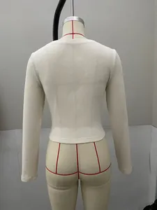 Detailed back view showing the ribbed knit texture and fit of a beige long-sleeve top