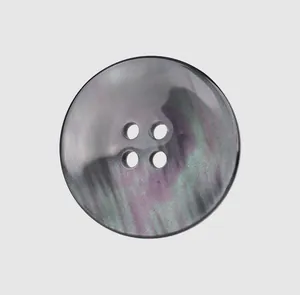Close-up of a high-end resin button with a pearlescent purple and green sheen.