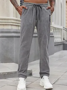 Men's casual grey fleece sweatpants with black drawstring and side pockets design