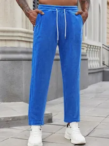 Men's bright blue fleece joggers with drawstring waist and pockets for casual wear.