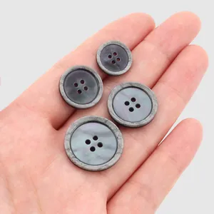 High-end Japanese resin buttons with metallic rim for clothing tops, set of four sizes.