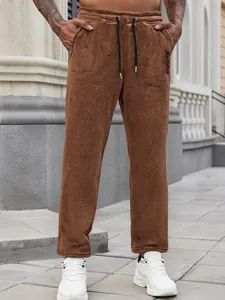 Men's brown textured fleece sweatpants with drawstring and pockets for casual wear