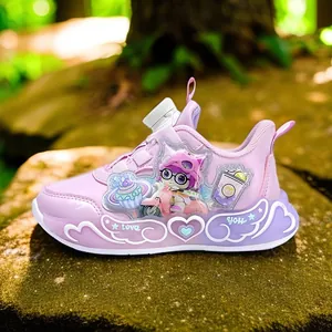 Pink and purple girls' LED sports sneakers with cute cartoon characters on a mossy rock