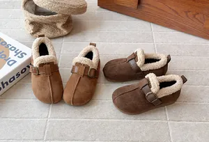 Close-up detail of retro suede fleece-lined winter shoes for girls in two warm colors.