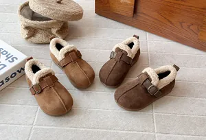 Detailed view of retro frosted girls' plush-lined winter shoes in brown shades.
