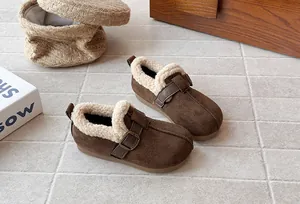 Detail view of brown frosted girl's winter shoes with warm white fleece lining