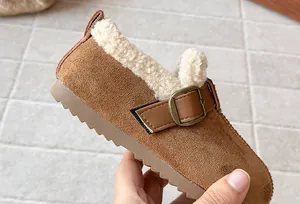 Detailed view of brown suede slip-on shoes for girls with warm cream fleece lining