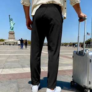 Detail view of black men's straight-leg casual trousers for travel and leisure
